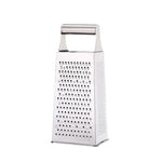 Four-sided stainless steel box grater on a countertop, ready for cheese or vegetable shredding