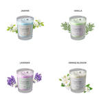 Four cup-shaped scented candles in a row, each labeled with a distinct fragrance (Jasmine, Vanilla, Lavender, Orange Blossom)