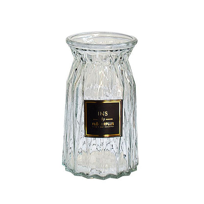 Decorative glass vase labeled for easy branding in hotel or homestay settings