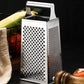 Close-up of the sturdy stainless steel construction and white accents on a compact box grater