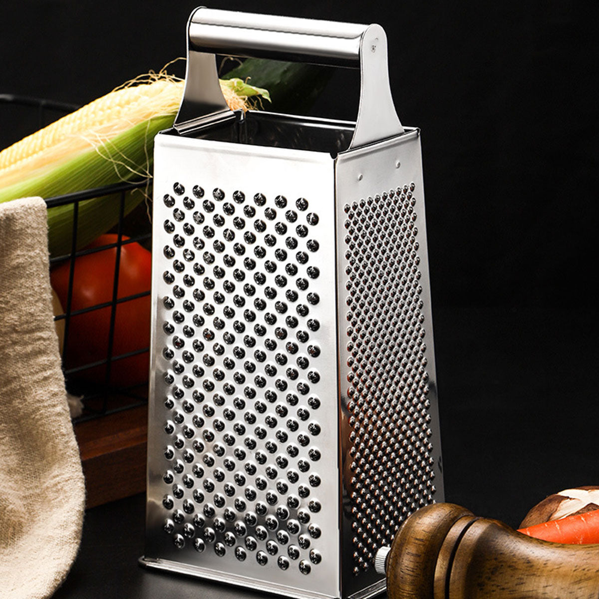 Close-up of the sturdy stainless steel construction and white accents on a compact box grater